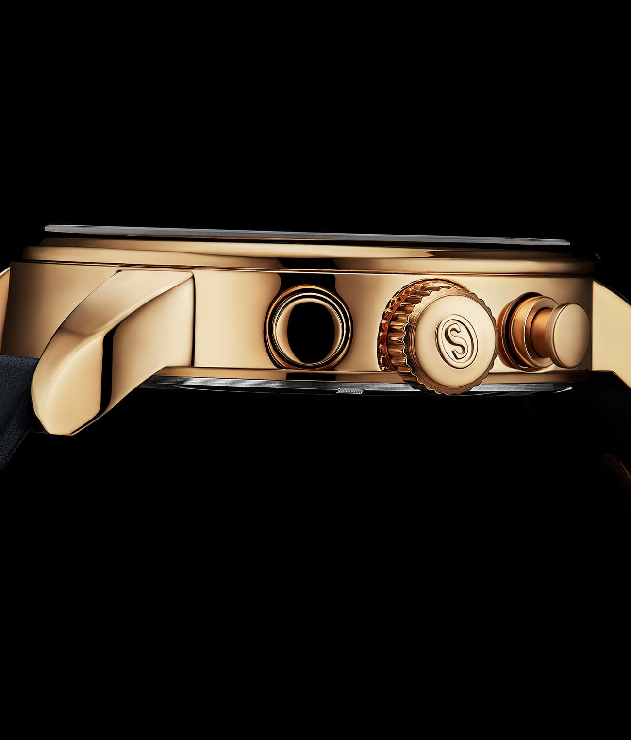 Gold watch with a brand logo on a black background